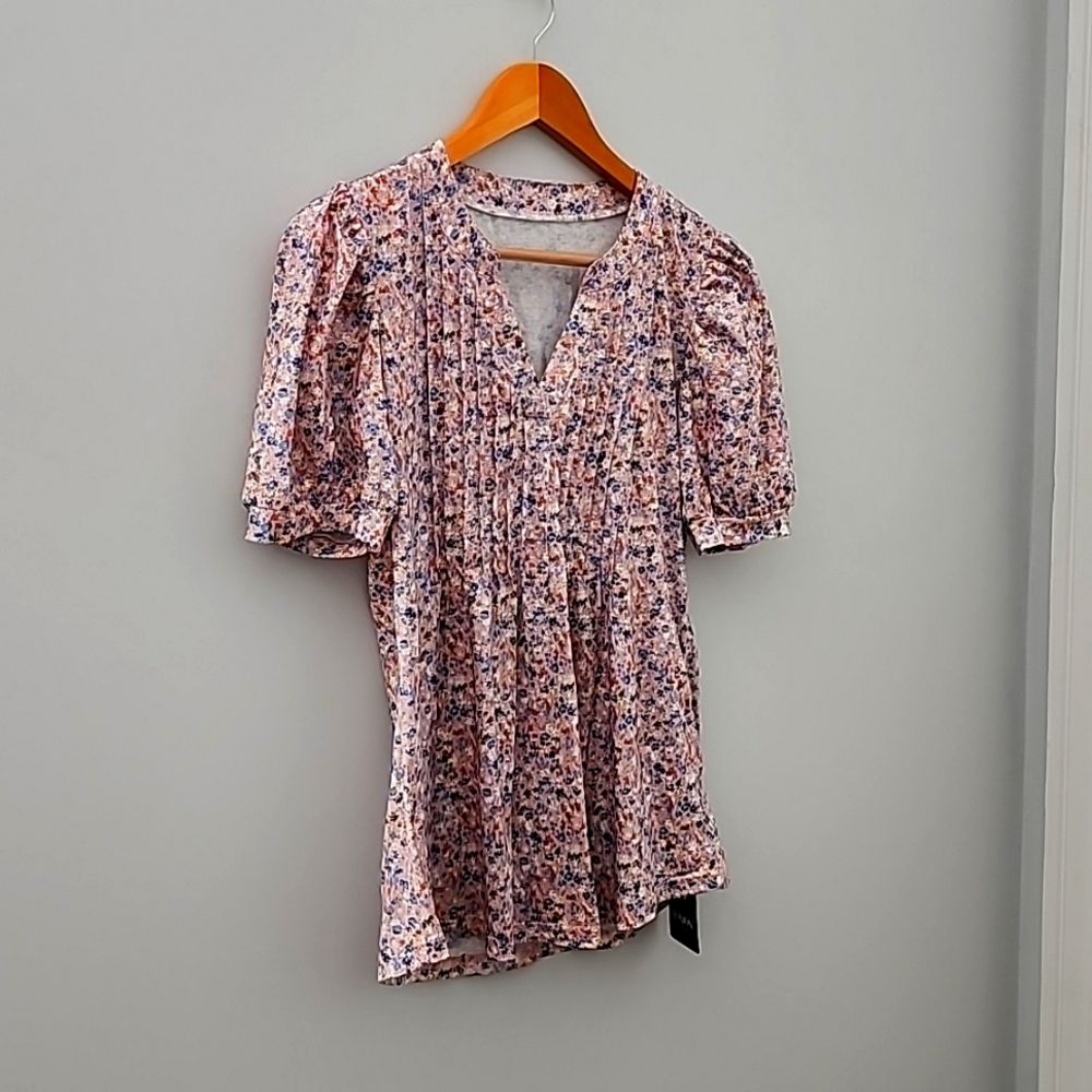 Short sleeve floral print shirt.